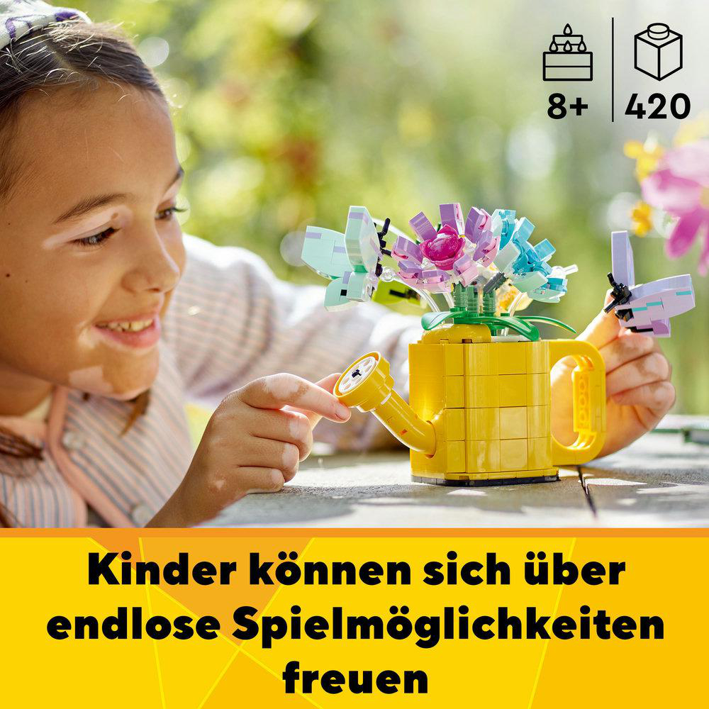 Ein Mädchen spielt mit Lego-Blumen in einer gelben Gießkanne, Text auf Deutsch.