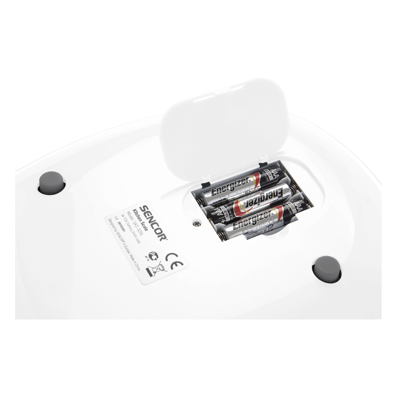 Biała waga kuchenna z otwartą komorą baterii, odsłaniającą baterie w środku.