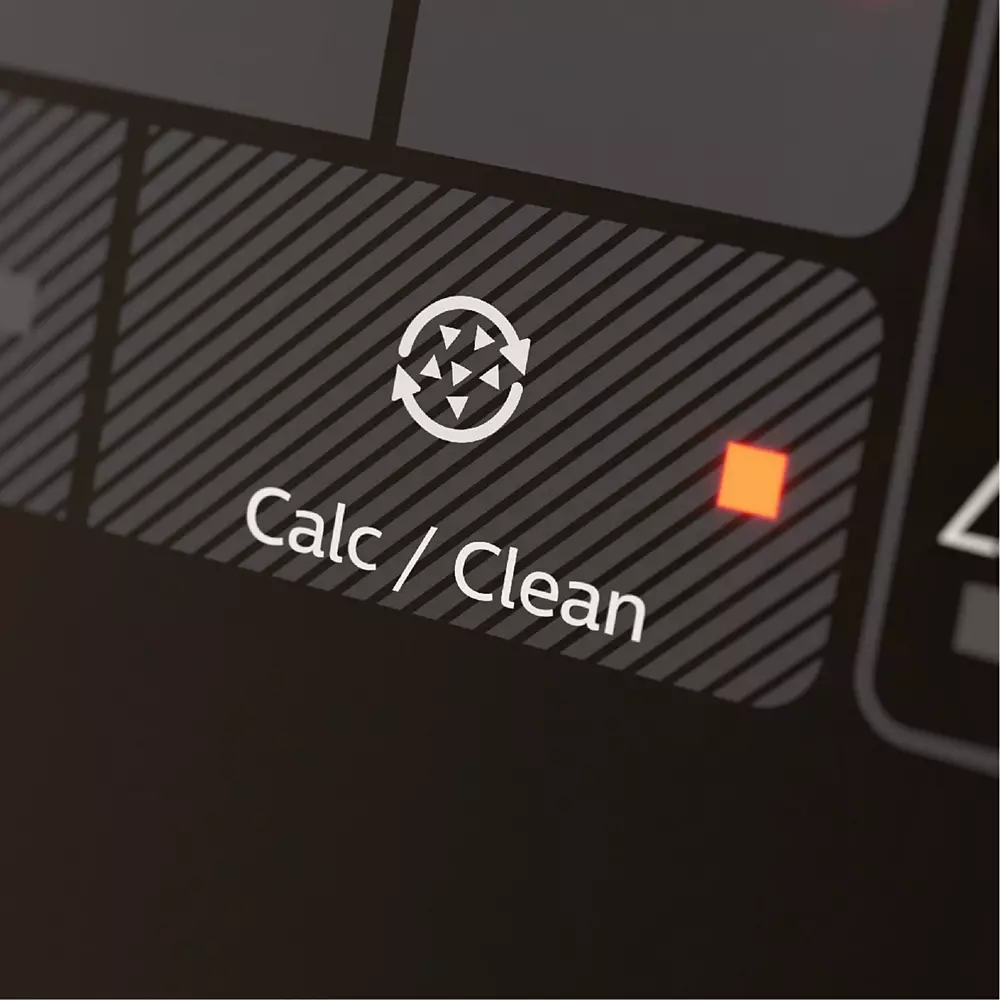 Primer plano de la pantalla de una calculadora mostrando un símbolo de limpieza y un indicador rojo.