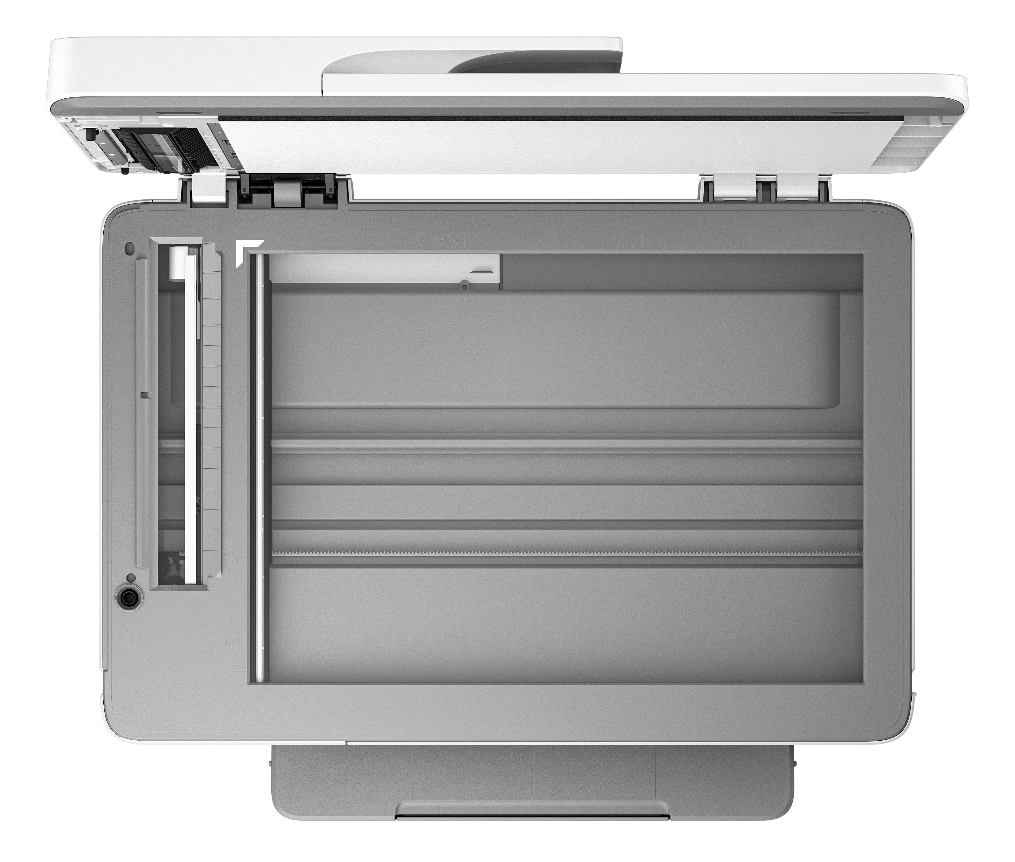 Draufsicht auf einen geöffneten Drucker-Scanner. Weiße und graue Farben.