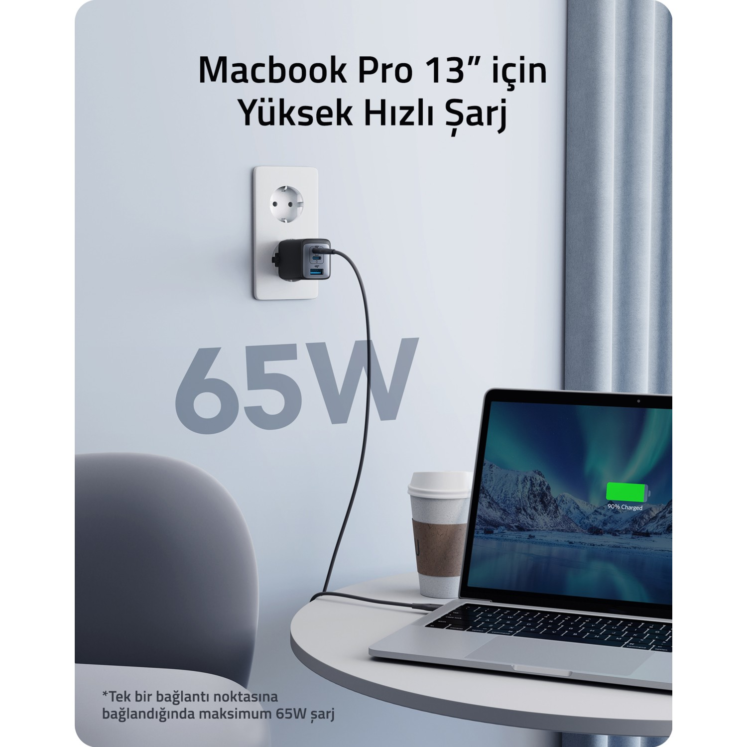 65W etiketli siyah bir şarj cihazı aracılığıyla bir prizden bir dizüstü bilgisayar.