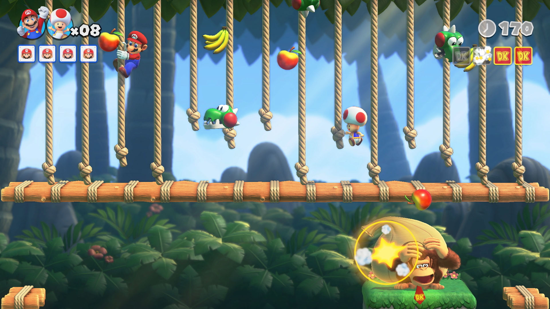 Escena del juego Donkey Kong con Mario, Toad y Yoshi. Frutas cuelgan de cuerdas. DK está a la derecha.