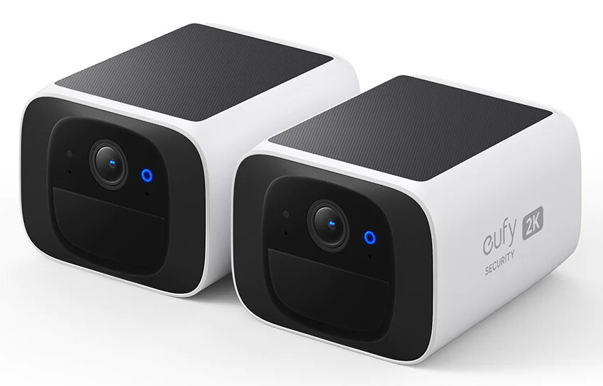 Dwie białe, prostokątne kamery bezpieczeństwa z czarnymi panelami słonecznymi.