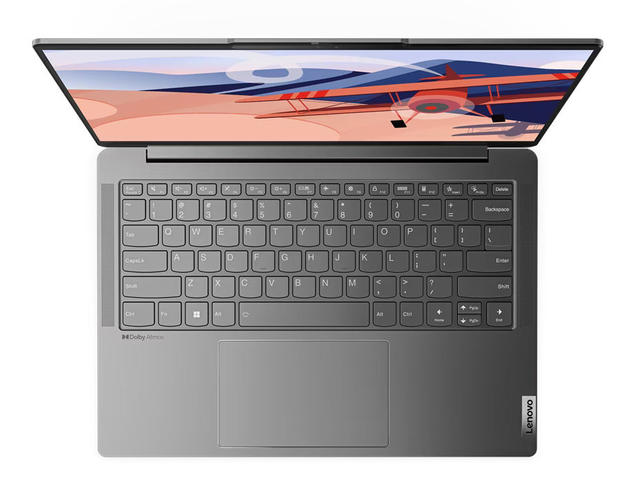 Laptop widziany z góry, pokazujący klawiaturę, touchpad i otwarty ekran z grafiką samolotu.