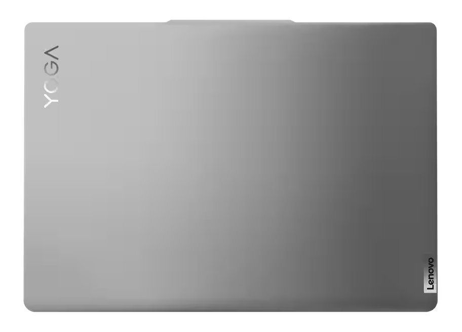 Srebrny laptop z napisem 'YOGA' na górze, zamknięty, na białej powierzchni.