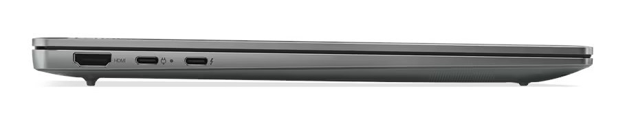 Widok z boku szarego laptopa. Laptop jest zamknięty, widać porty i krawędzie.