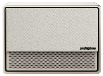 Biały prostokątny głośnik. Przód ma osłonę z siatki i logo marki.