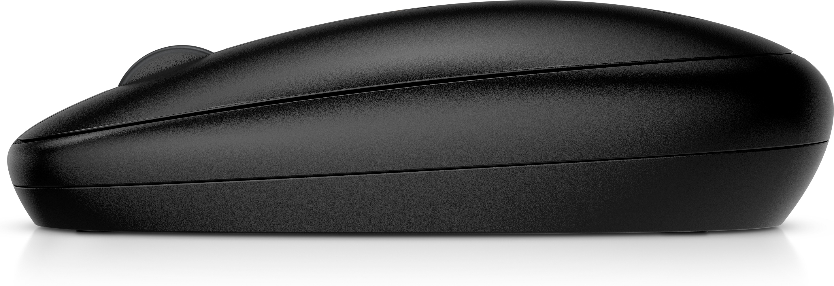 Vue latérale d'une souris d'ordinateur noire sur une surface blanche. Design épuré.