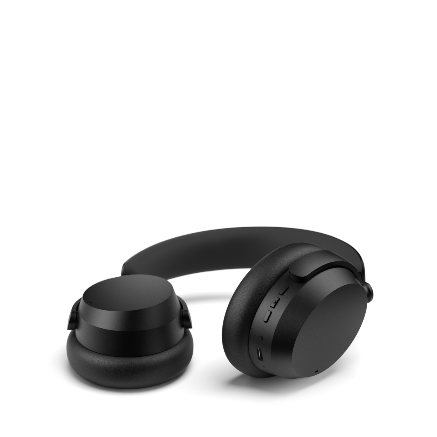 Black headphones with controls on the right earcup, isolated on white.