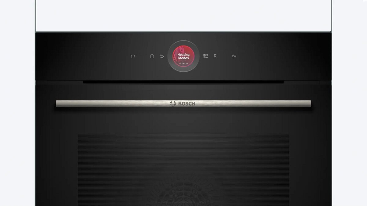 Czarny panel sterowania piekarnika z czerwonym okrągłym wyświetlaczem i srebrnym uchwytem.