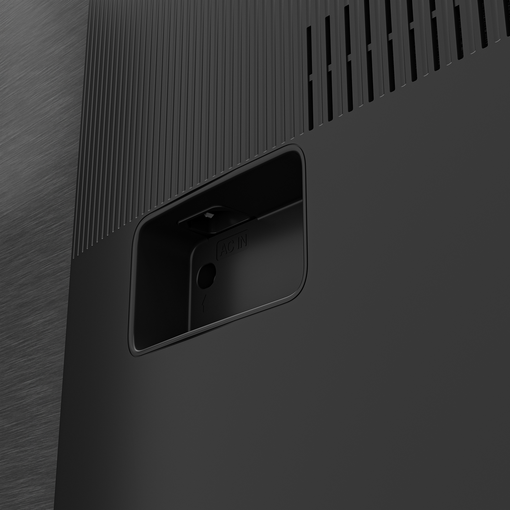 Siyah cihazın arkası, AC IN portu görünür. Karanlık arka plan.