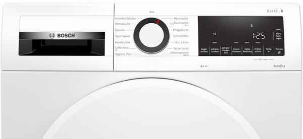 Nahaufnahme des Bedienfelds einer weißen Bosch Waschmaschine. Es hat einen Drehregler, ein Digitaldisplay und Tasten.