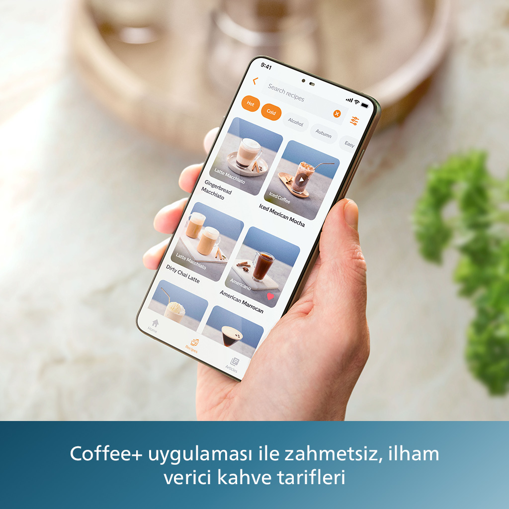 Siyah bir kabloyla bağlanan bir tablet ve bir monitör. Tablet bir masanın üzerinde.