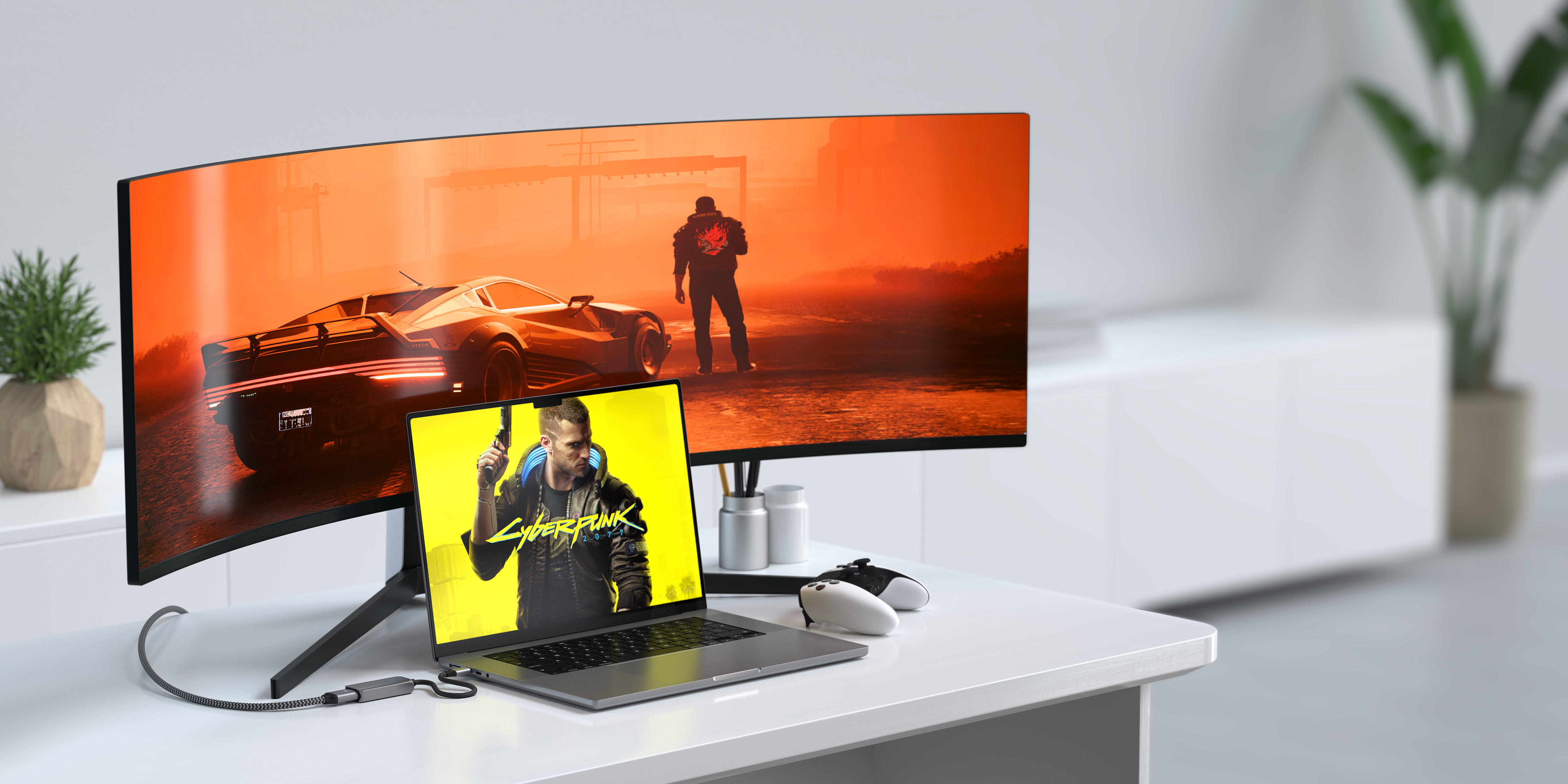 Ein Laptop, der an einen gebogenen Monitor angeschlossen ist. Eine Spielszene wird angezeigt. Weiße Controller.