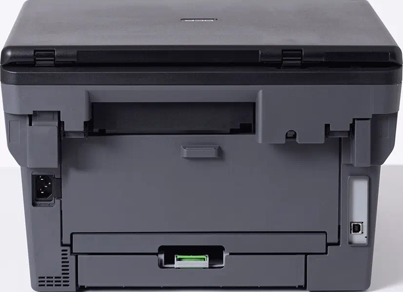 Rückansicht eines Brother-Druckers. Grau-schwarzes Design, mit Strom- und USB-Anschlüssen sichtbar.
