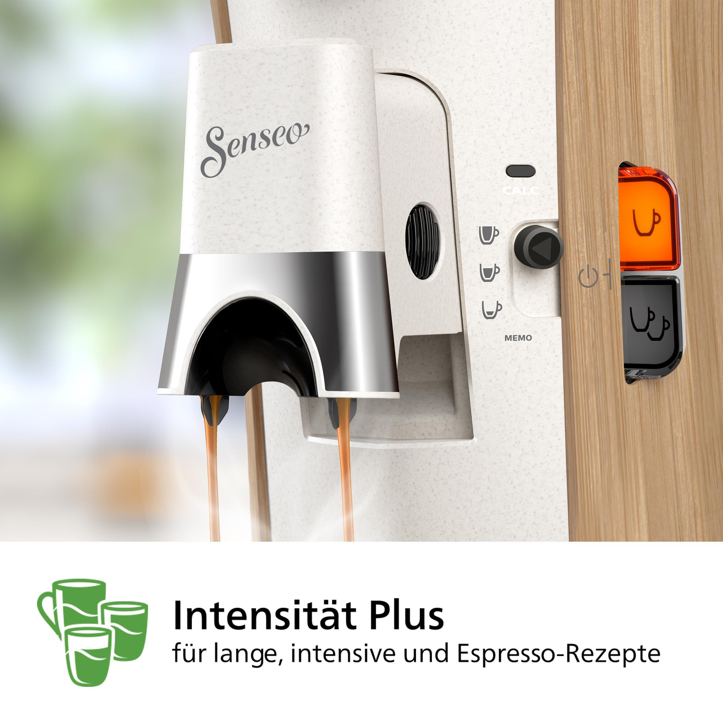 Weiße und hellbraune Kaffeemaschine mit zwei Tassen und Text.