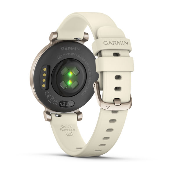 Garmin Lily 2 Smartwatch, cremefarbenes Armband, schwarzes Zifferblatt, grünes Licht.