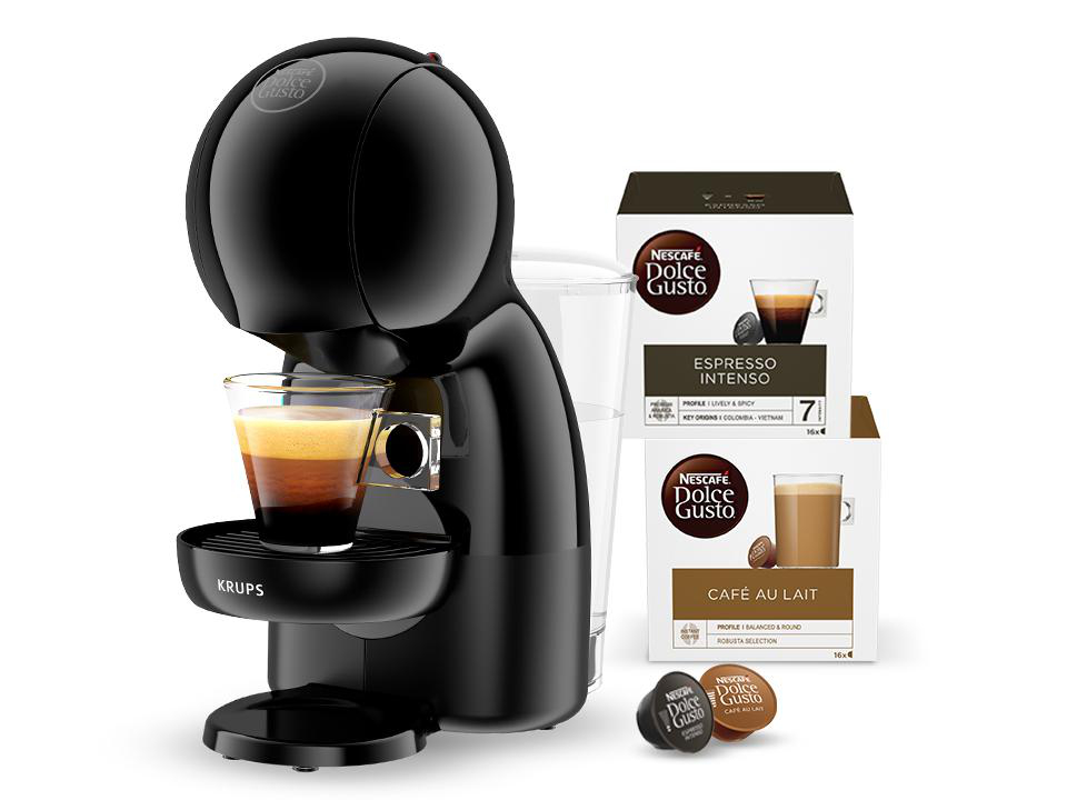 Schwarze Dolce Gusto Kaffeemaschine, Glas und Kapseln mit Espresso- und Café au Lait-Boxen.