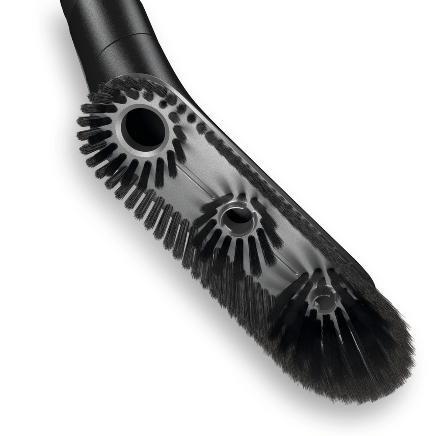 A close-up of a vacuum cleaner brush with black bristles. The brush is angled.