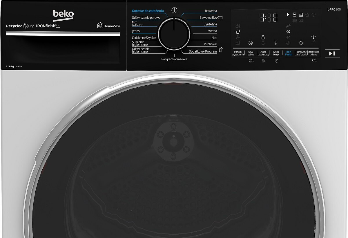 Zbliżenie panelu sterowania suszarki. Posiada przyciski i okrągłe pokrętło.