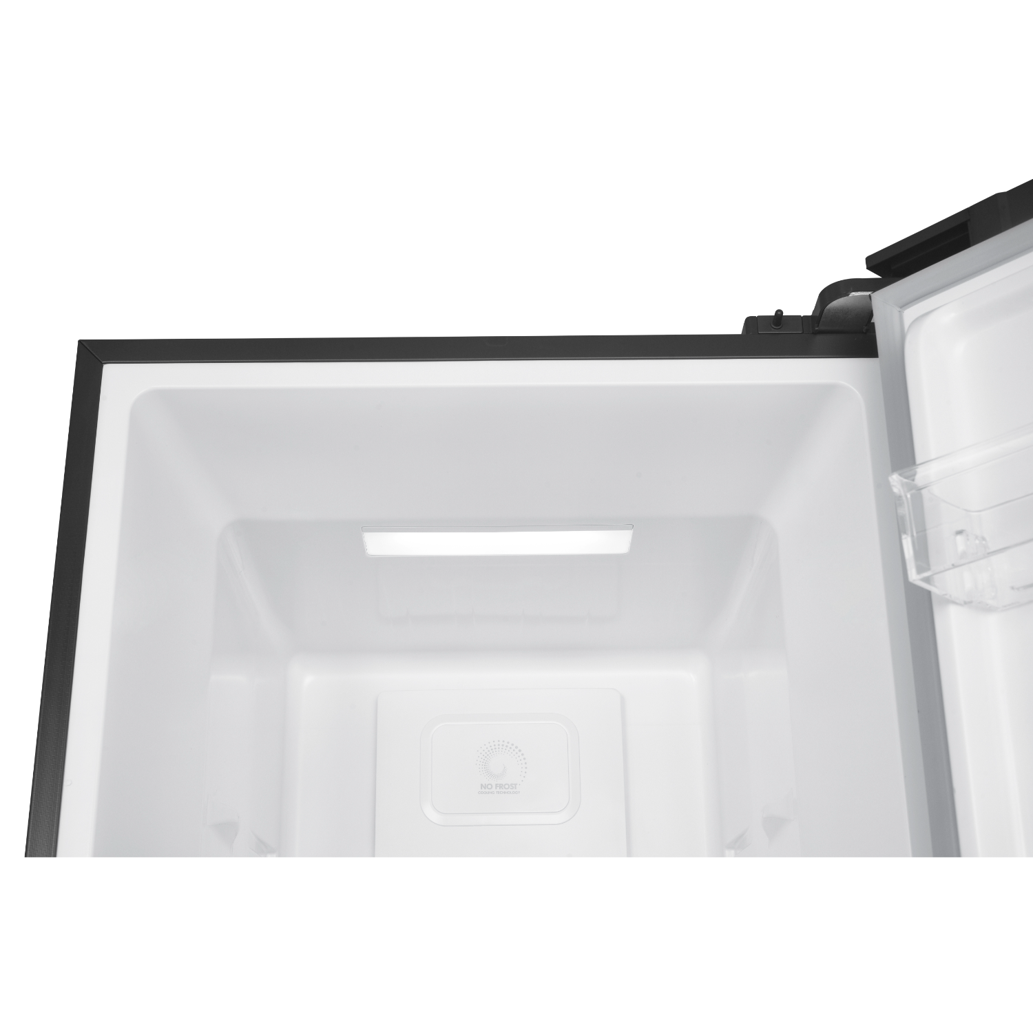 Inside of a refrigerator. White interior, with a light and a 'no frost' label visible.