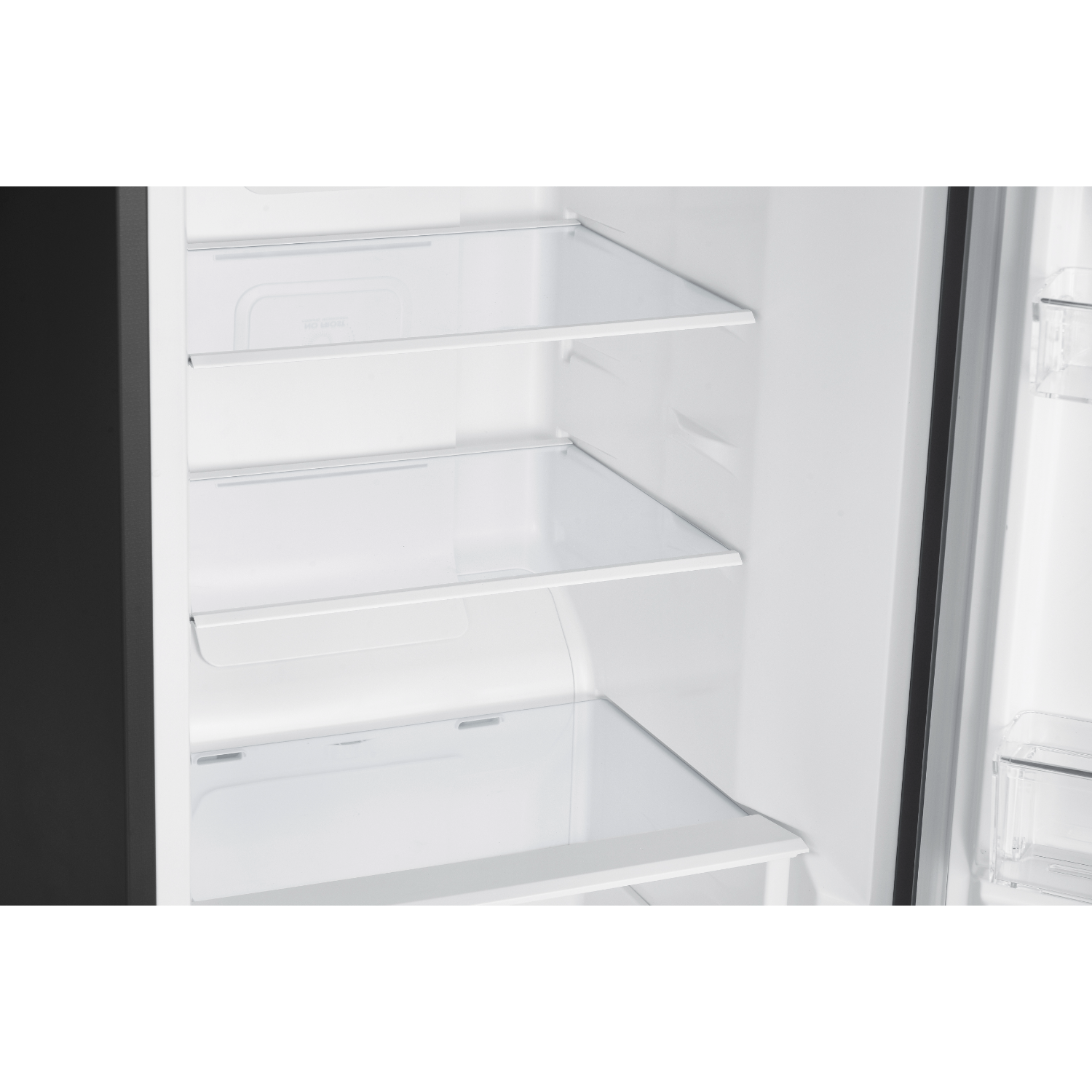 A fridge interior with glass shelves.