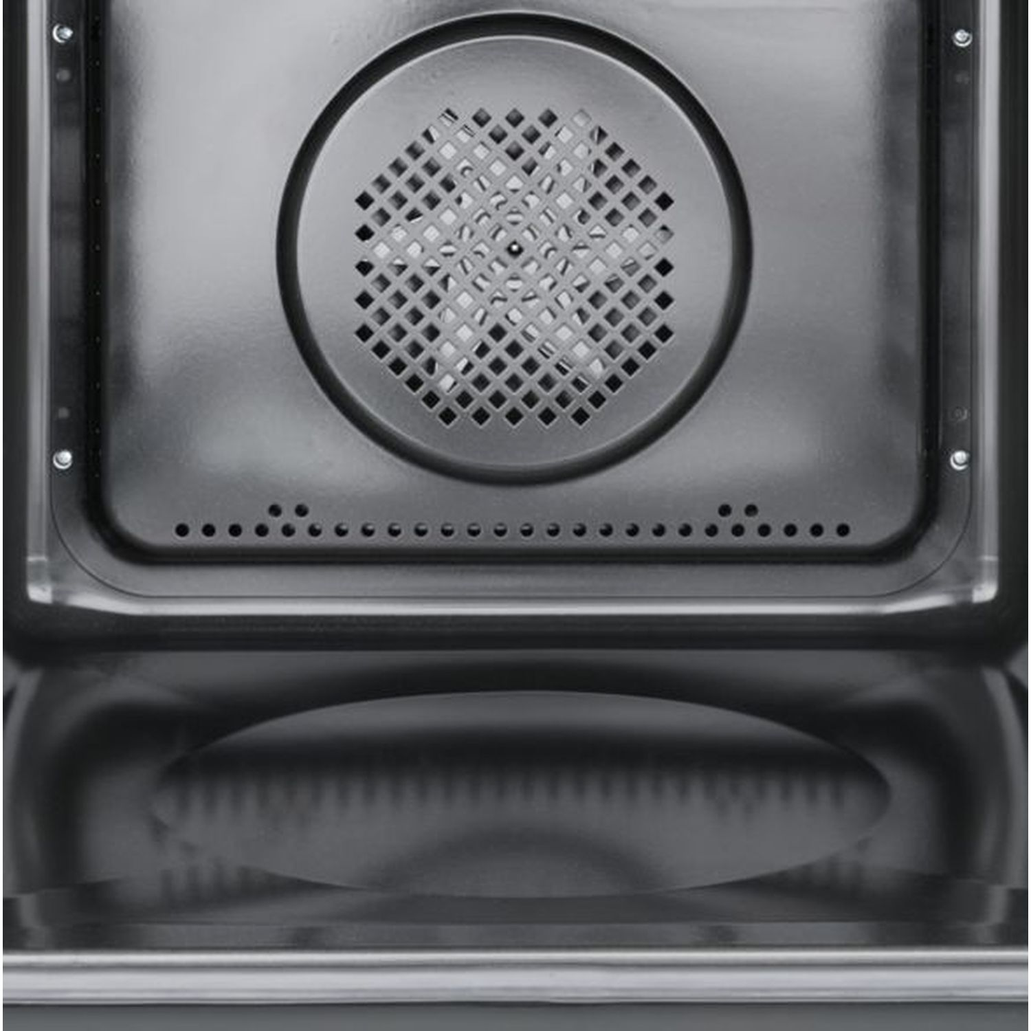 Binnenkant van een oven, met een ronde ventilatieopening en reflectie.