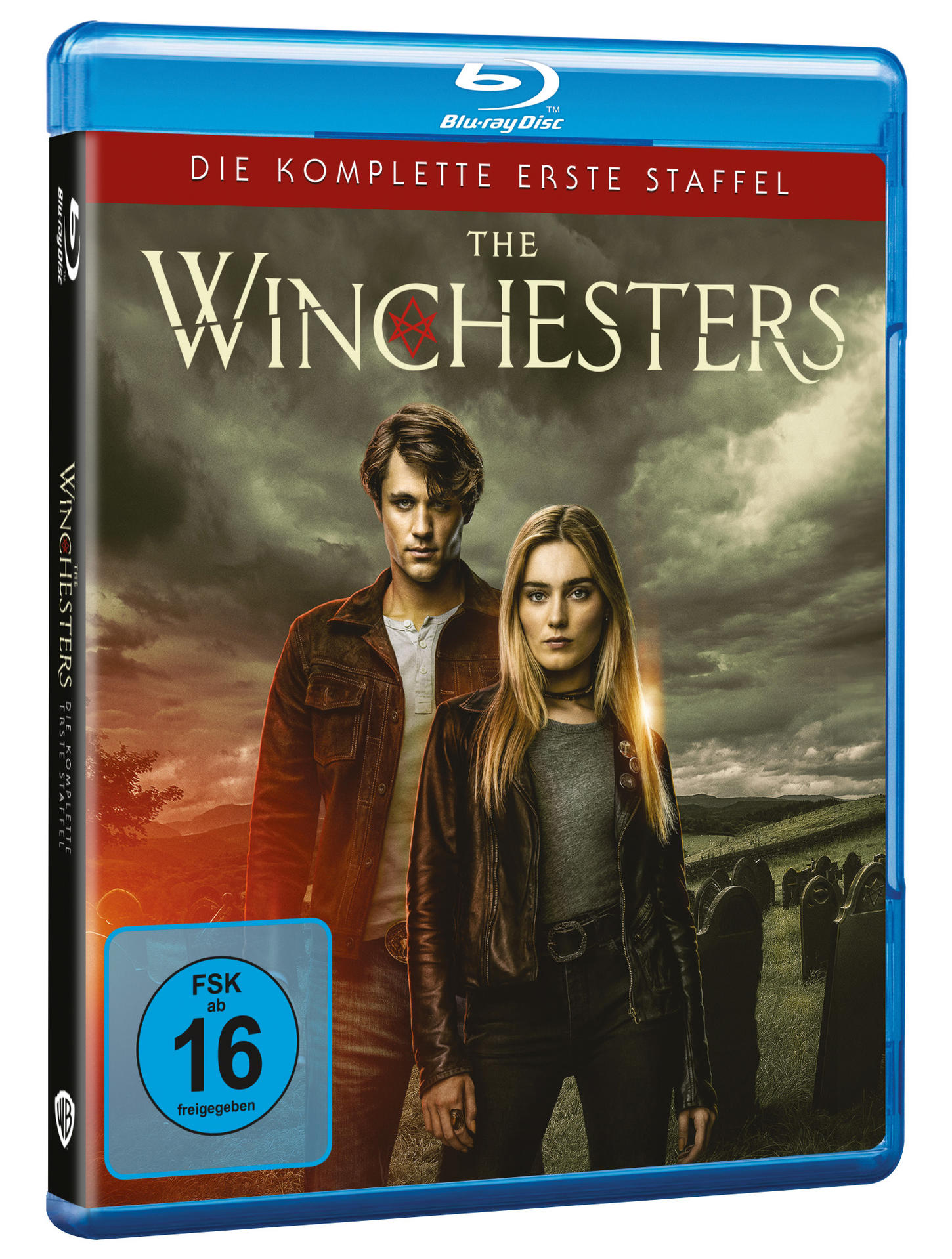 Blu-ray-Disc-Cover der Serie The Winchesters. Zwei Personen stehen vor einem Friedhof.