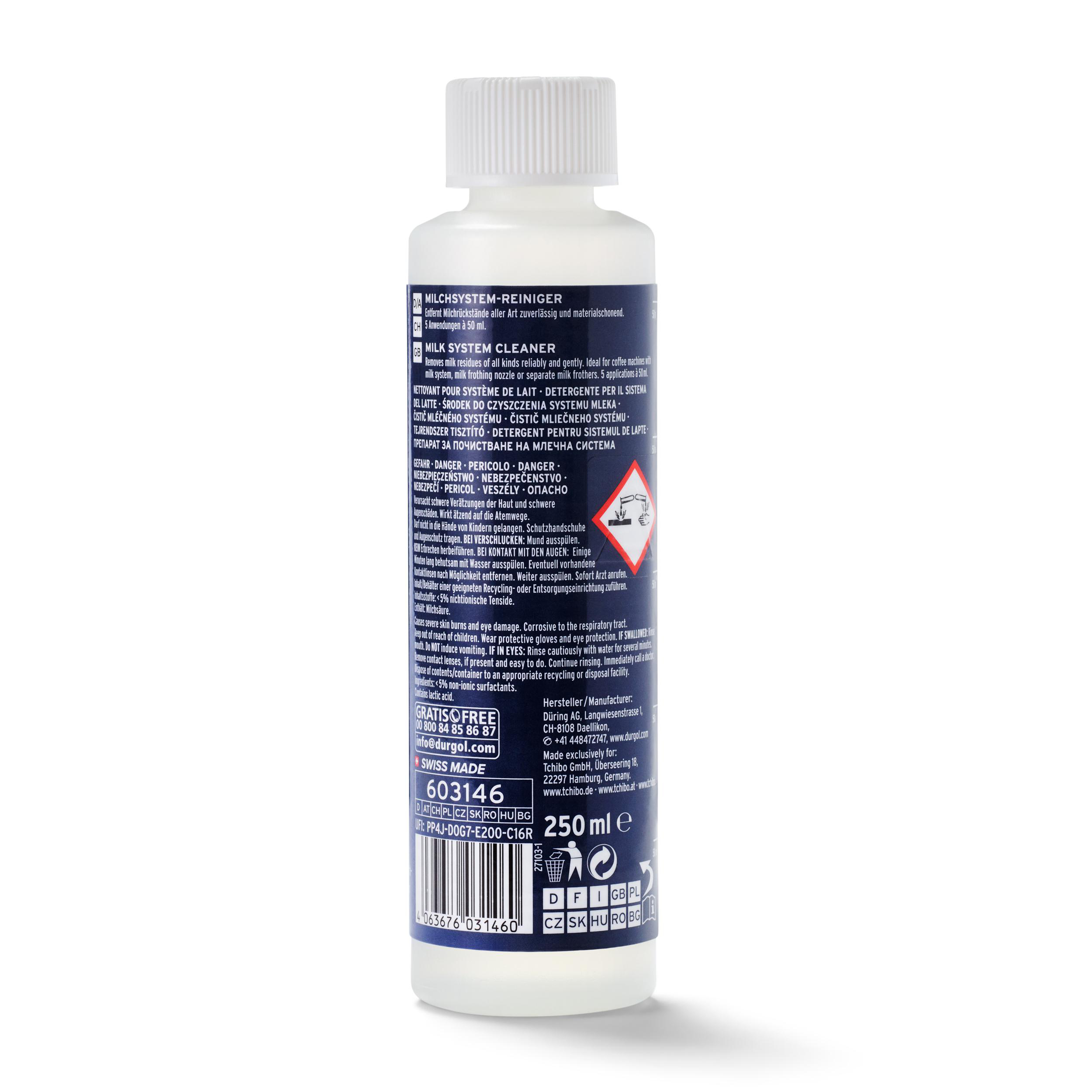 Eine Flasche Milchsystemreiniger. Sie hat ein weißes Etikett mit Anweisungen und Warnhinweisen.