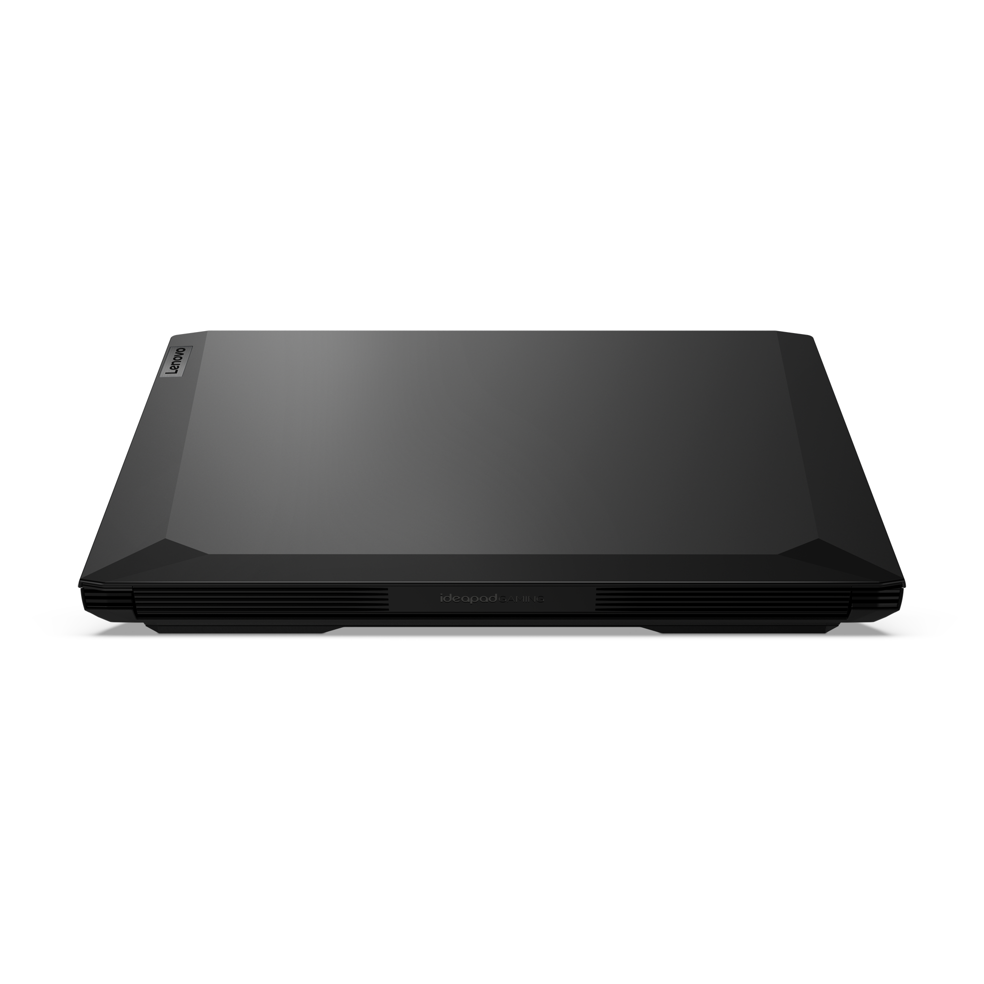 Laptop Lenovo Ideapad negro, cerrado y visto desde arriba contra un fondo completamente negro.