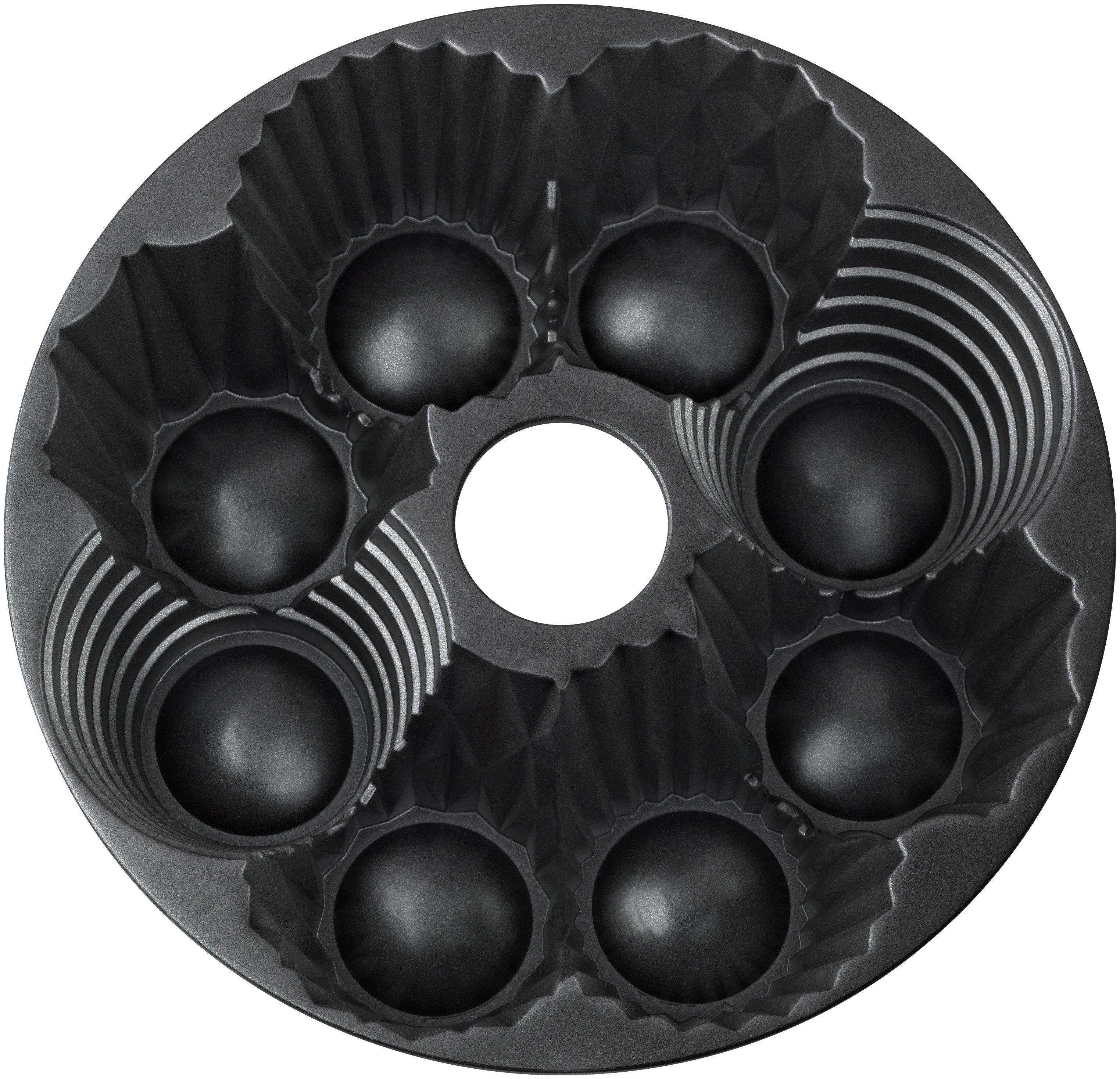 Eine dunkle Metall-Muffinform mit sechs Muffinformen und einem Mittelring.