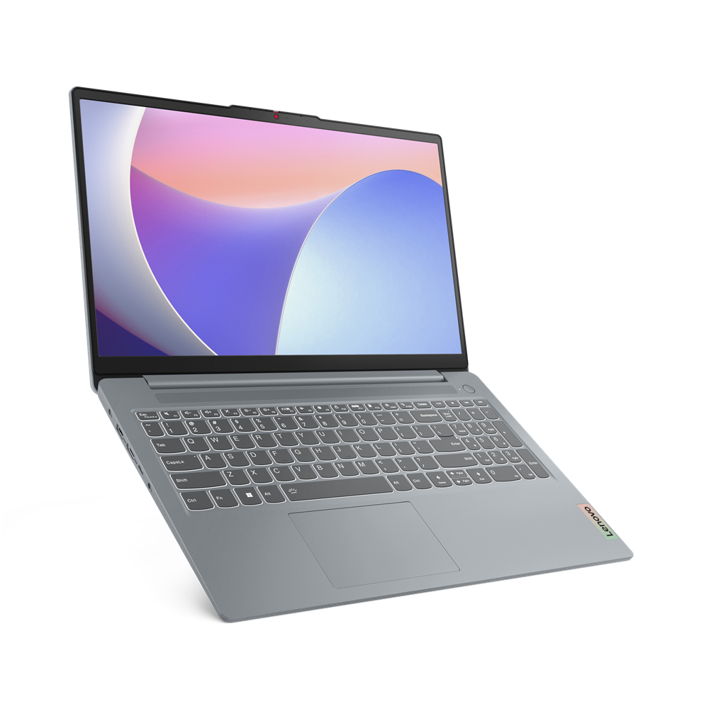 Un portátil Lenovo gris. La pantalla muestra un diseño abstracto colorido. El teclado es visible.