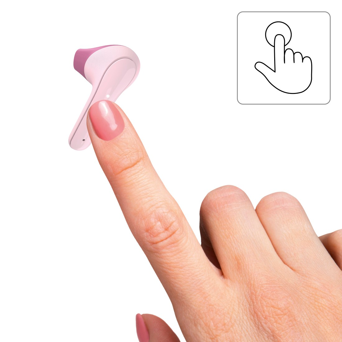 Un doigt touche un appareil rose et blanc.