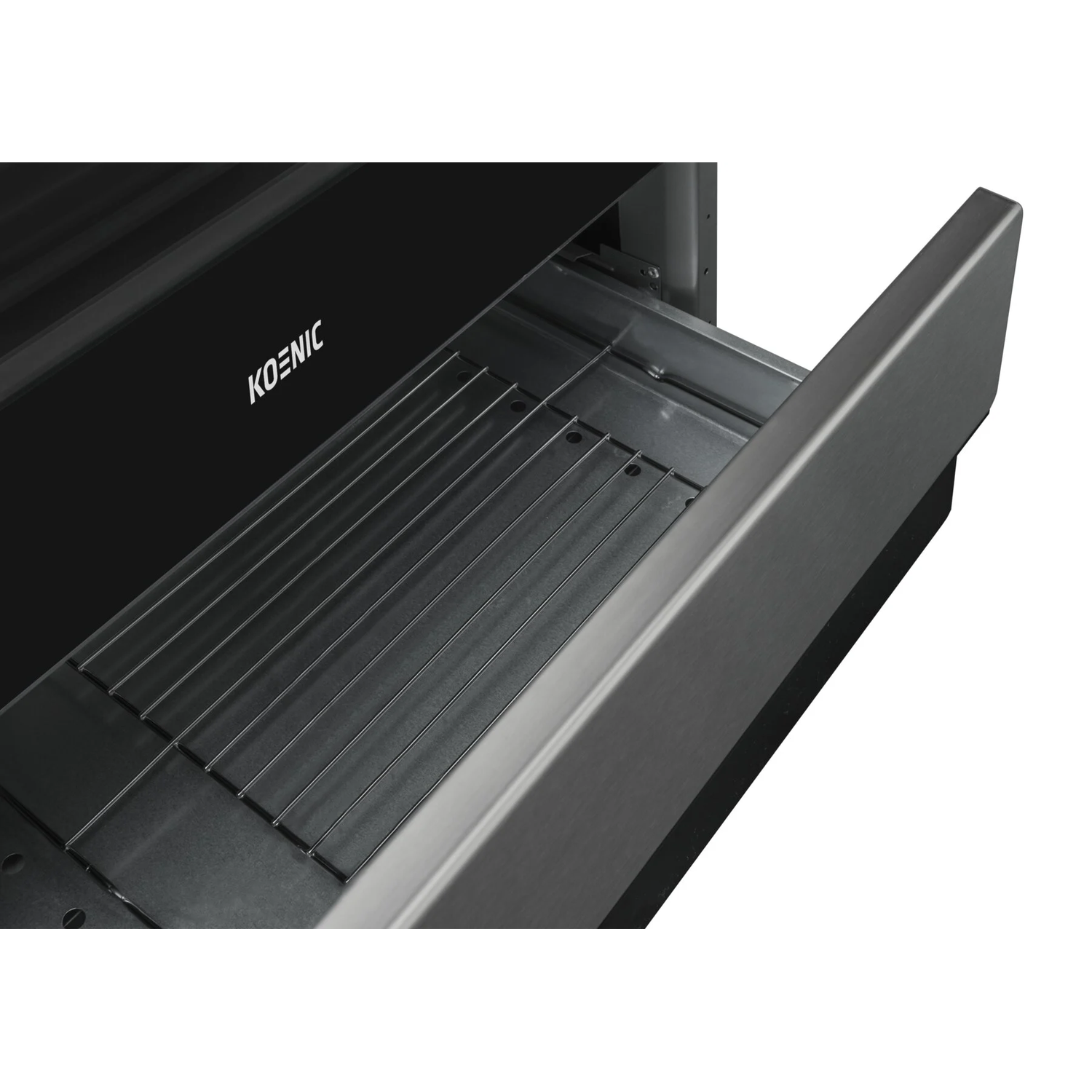 Close-up of a black oven drawer with a wire rack inside and the KOENIC logo.