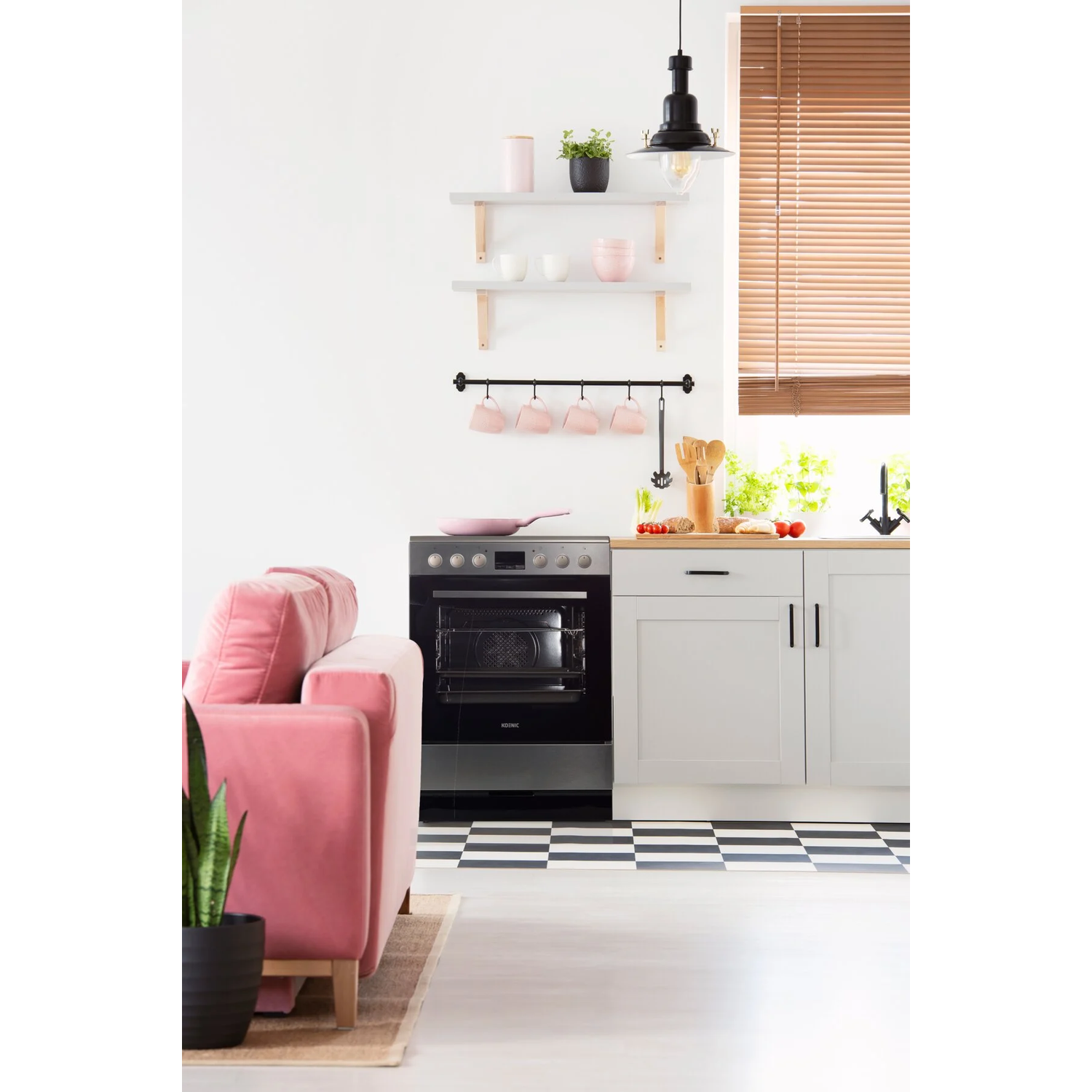 Pink sofa, black and white checkered floor. Kitchen with oven, shelves with plants and cups, wooden blinds, and a black light.