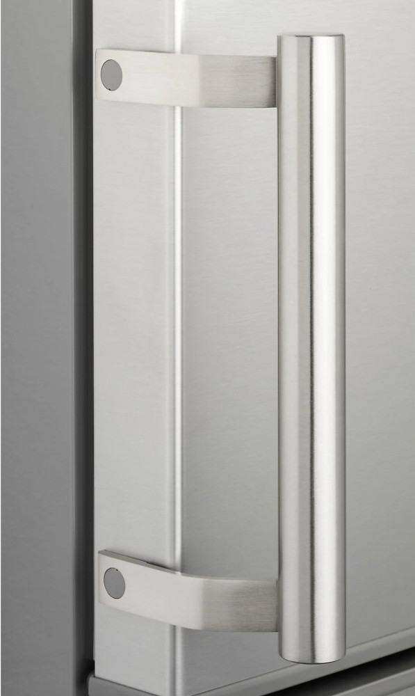 Close-up of a refrigerator door handle, stainless steel. Vertical, cylindrical shape.