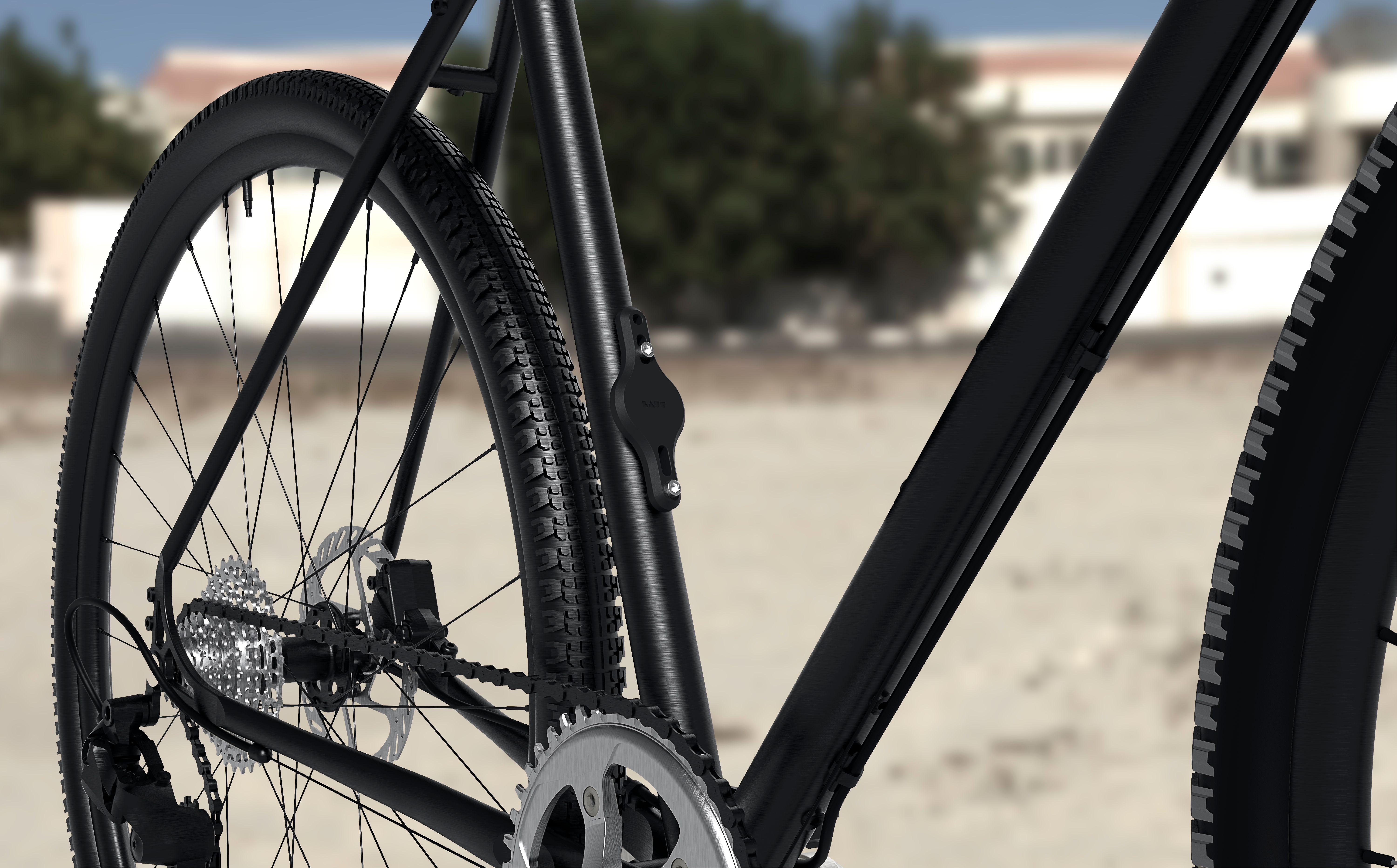 Nahaufnahme von schwarzem Fahrrad-Hinterrad, Kette und Gängen. Verschwommener Hintergrund.