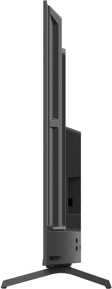 Zijaanzicht van een zwarte tv op een standaard. Tegen een witte achtergrond. Slank ontwerp.