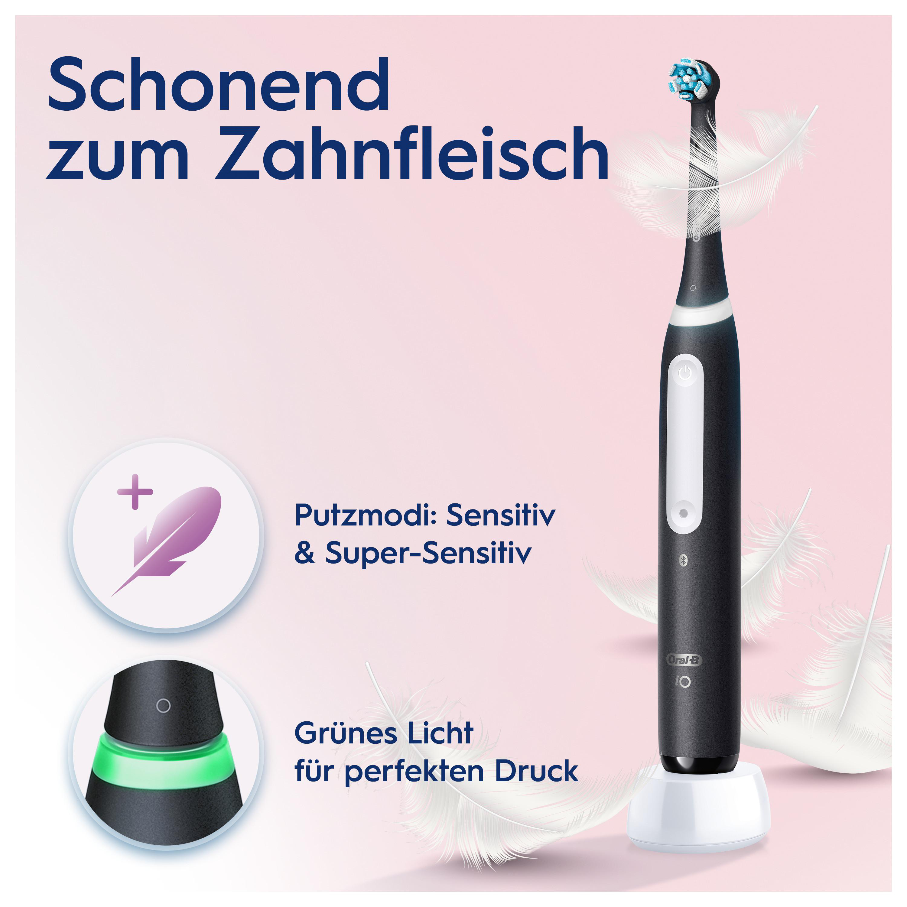 Schwarze elektrische Zahnbürste mit Federn und Text, mit weißer Basis und grünem Licht.