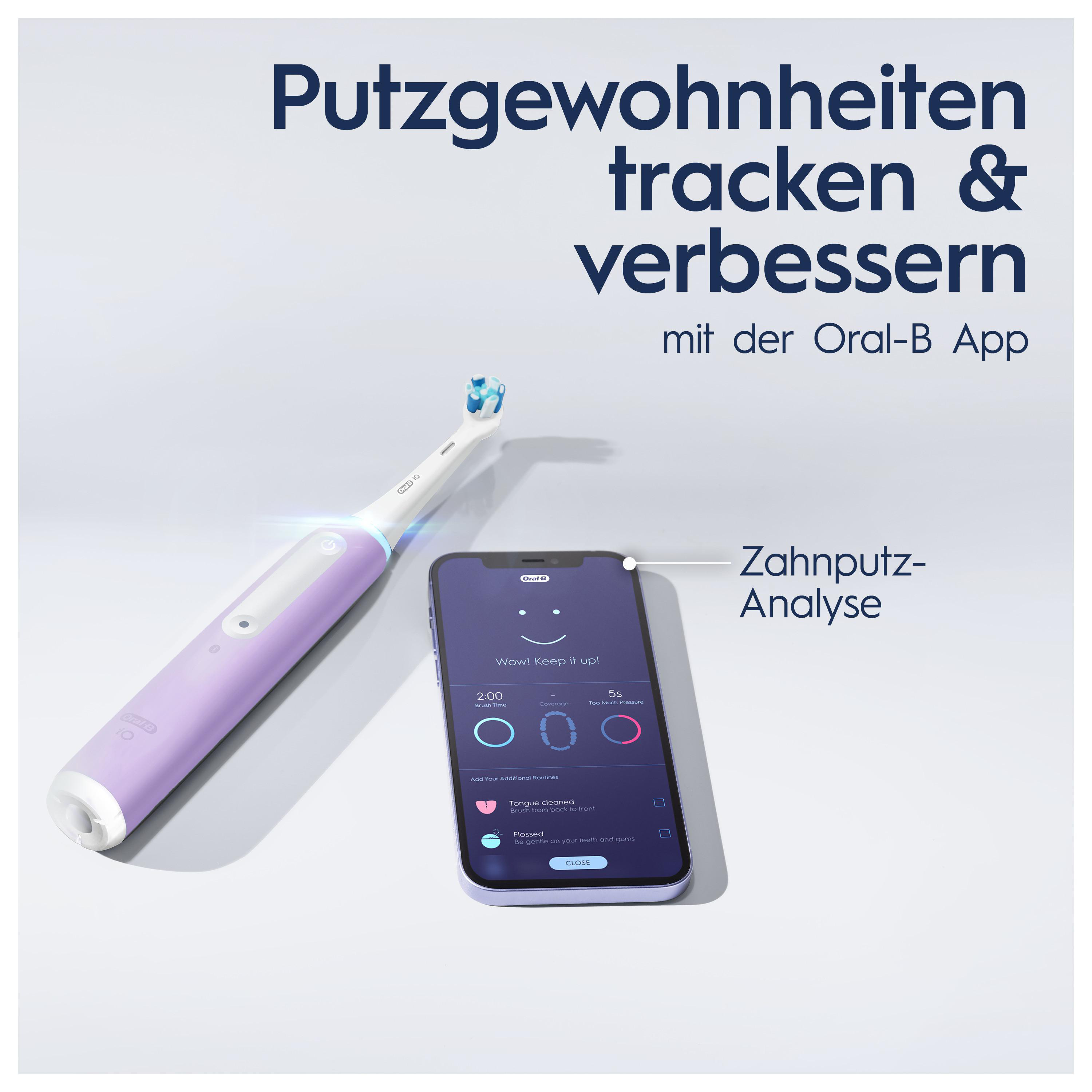 Telefon und Zahnbürste. Das Telefon zeigt die App-Oberfläche für das Zähneputzen. Es gibt eine lila Zahnbürste.