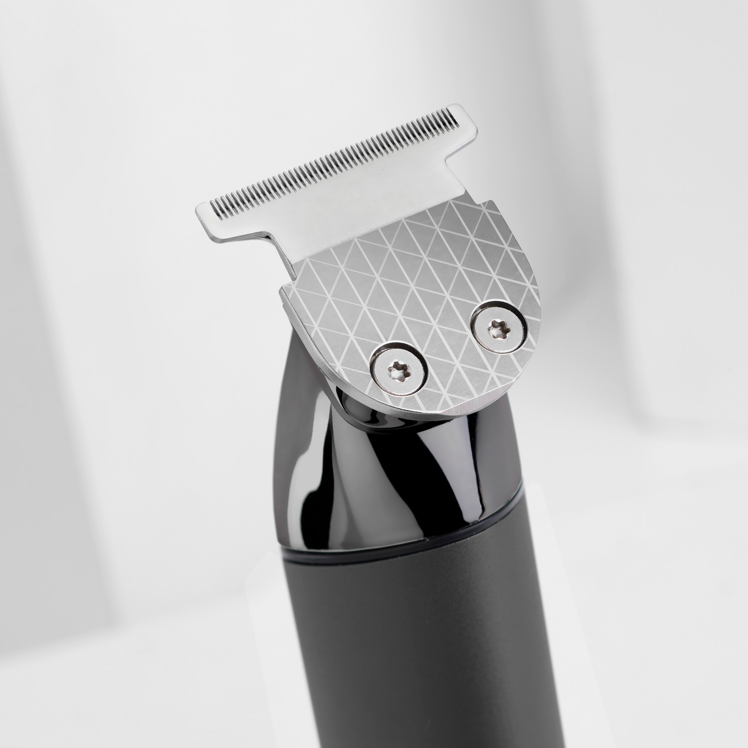 Close-up of a black and silver hair clipper.