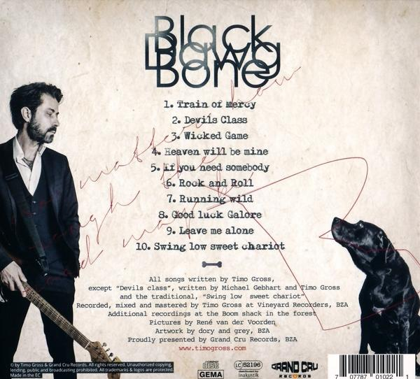 Albumcover mit dem Titel 'Black Bone' und Titelliste, Mann und Hund.