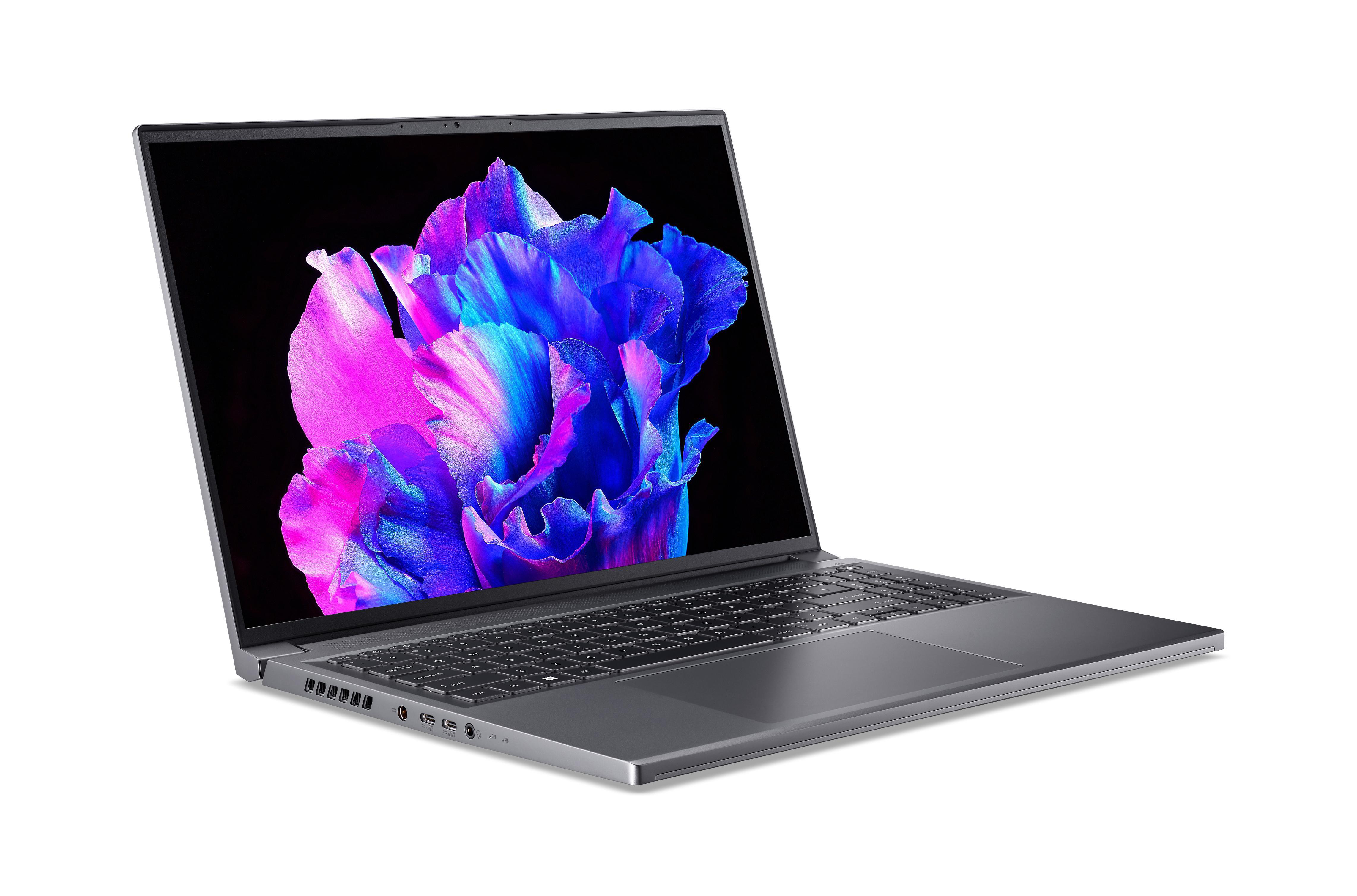 Silberner Laptop mit farbenfrohem Bildschirm. Der Bildschirm zeigt ein Blumenbild mit rosa und blauen Farbtönen.