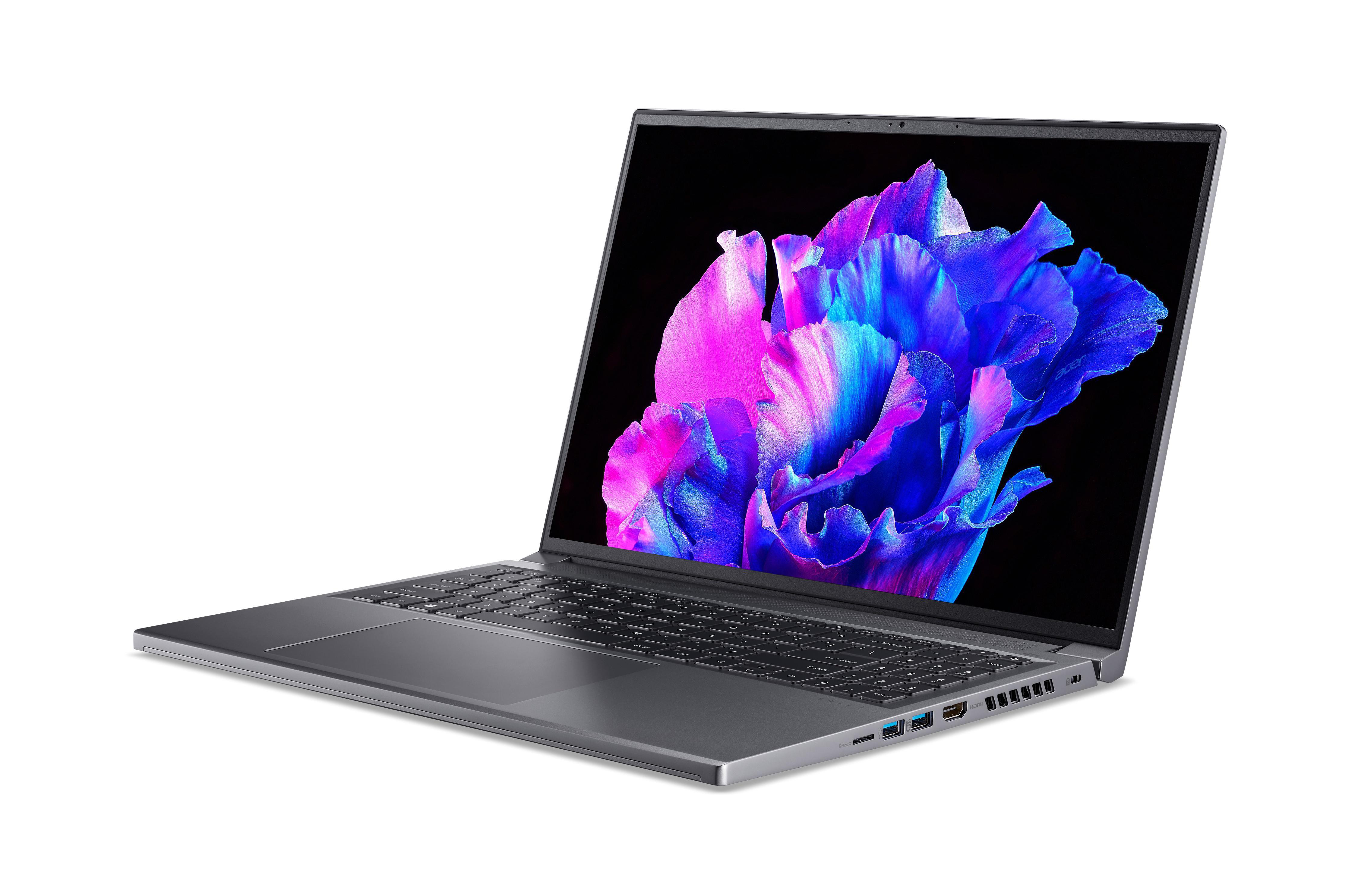 Geöffneter grauer Laptop mit farbenfroher Anzeige.