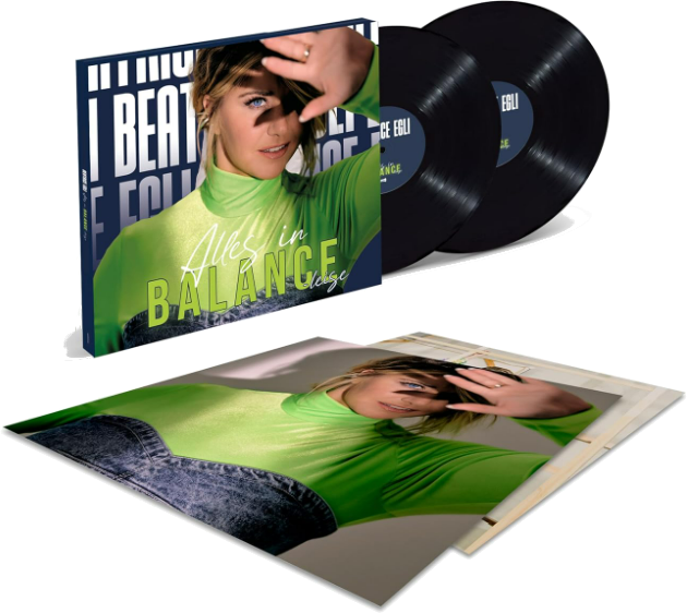 Albumcover und zwei schwarze Vinylplatten. Das Cover zeigt eine Frau und den Text 'Alles in Balance'.