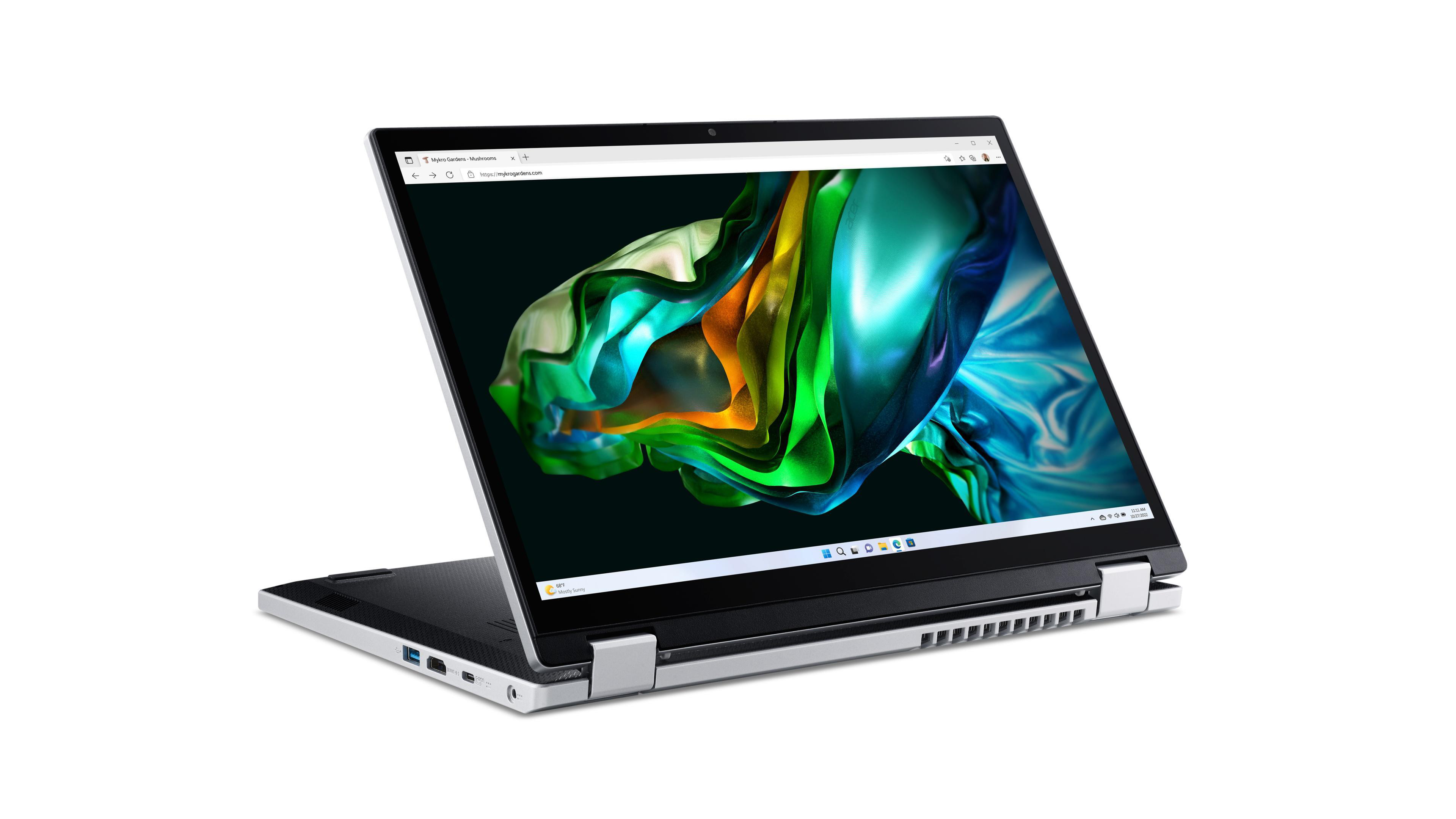 Ein Laptop ist geöffnet und zeigt einen farbenfrohen Bildschirm. Es steht auf einer weißen Oberfläche.