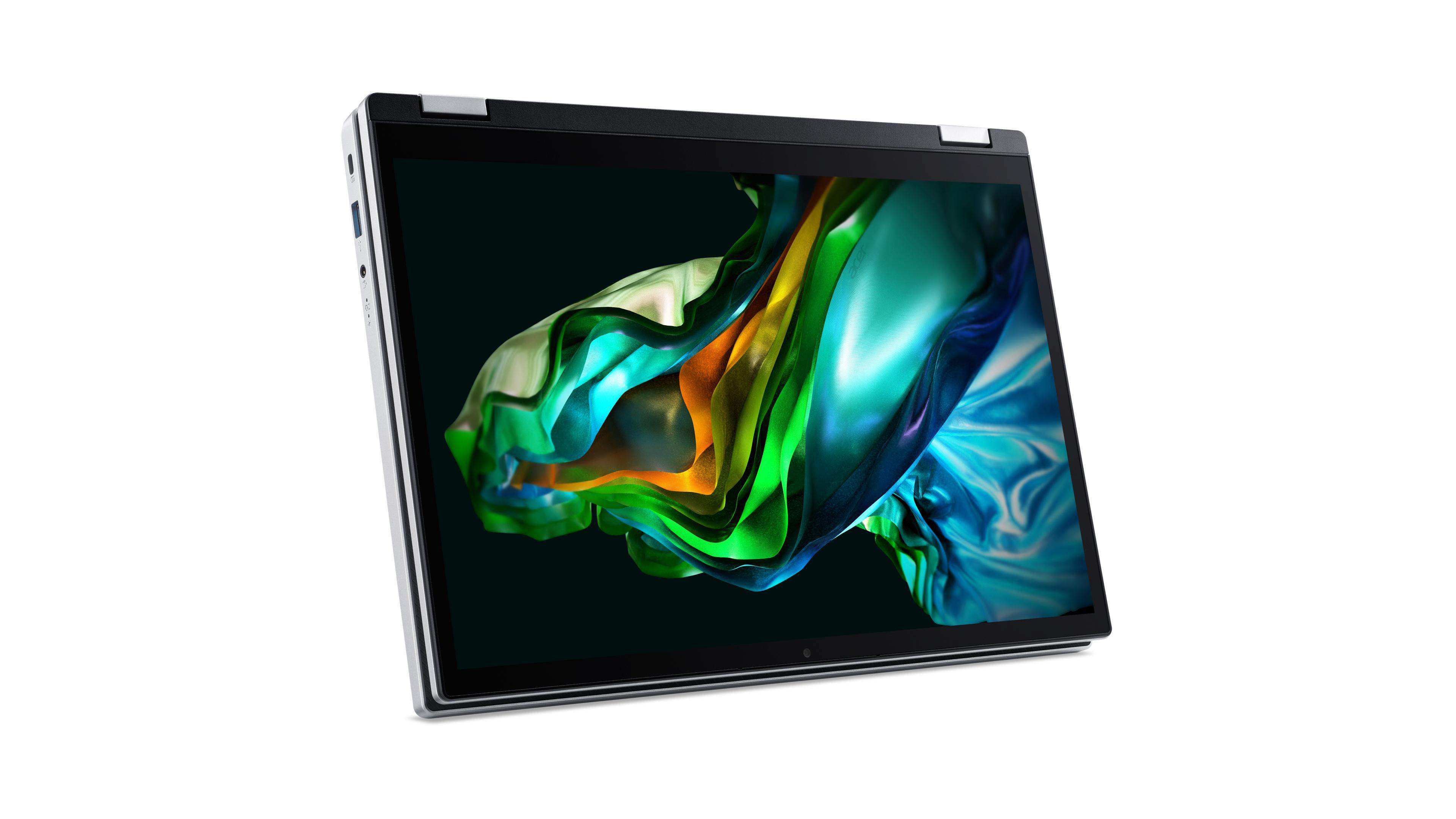 Silberner Laptop geöffnet. Bildschirm zeigt farbenfrohe abstrakte Kunst. Weißer Hintergrund.