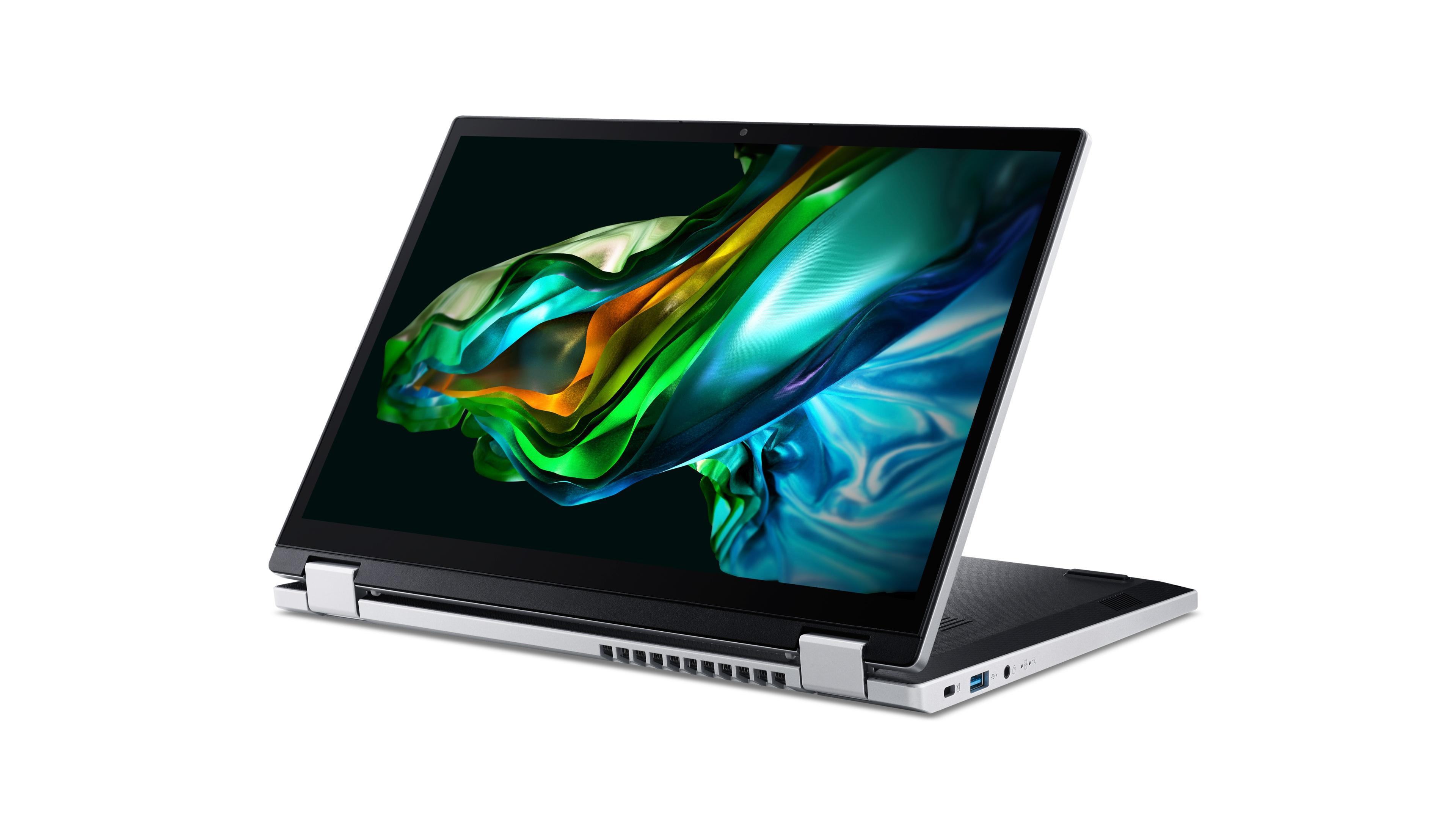 Silberner Laptop mit offenem Bildschirm, der bunte Kunst zeigt.