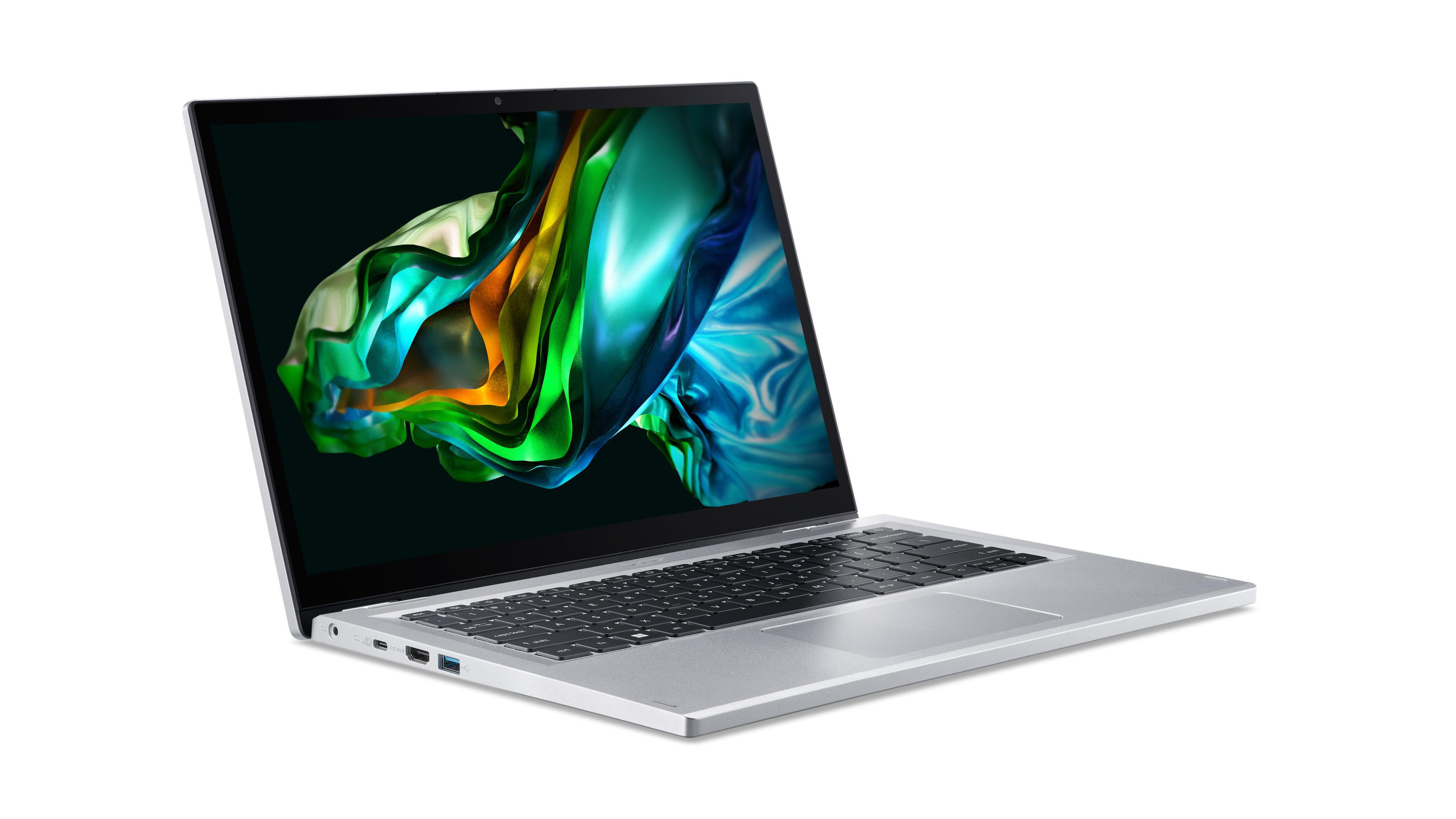 Ein silberner Laptop auf weißer Oberfläche, der Bildschirm zeigt bunte Kunst.