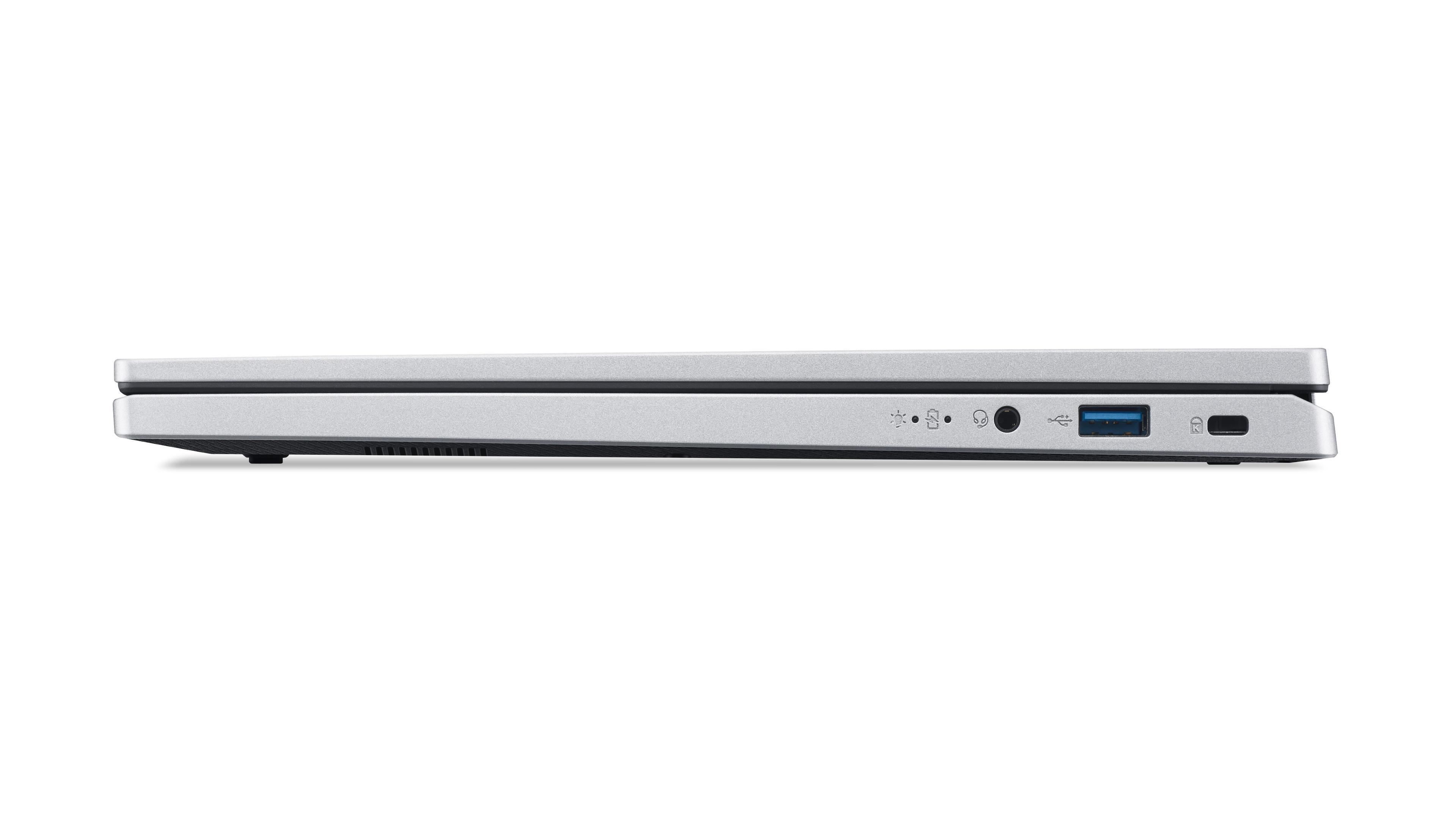 Silberner Laptop, Seitenansicht, zeigt Anschlüsse und Design. Weißer Hintergrund. Computer ist geschlossen.